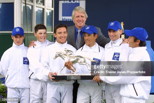 Former Australian cricketer Jeff Thomson presenting the trophy to the 'Rest of the World Team' for winning The Shergar Cup, left to right jockeys...