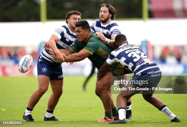 Hull Kingston Rovers' Albert Vete is tackled by Wigan Warriors' Oliver Partington , Joe Shorrocks and Junior Nsemba during the Betfred Super League...