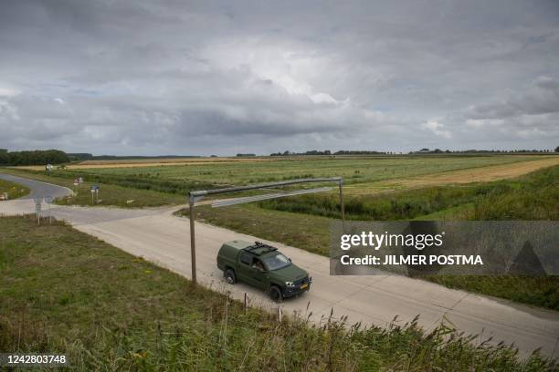 Photograph taken on August 29, 2022 shows a field at the Zoutkamp barracks where an emergency shelter location will be established for asylum...