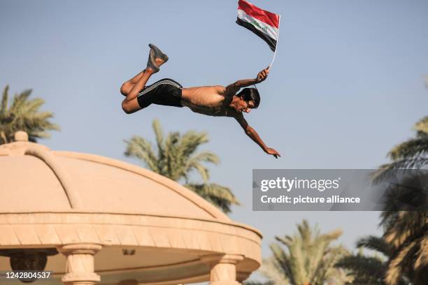 August 2022, Iraq, Baghdad: A supporter of Shiite cleric Muqtada Al-Sadr takes part in a protest in the grounds of the Government Palace. Followers...