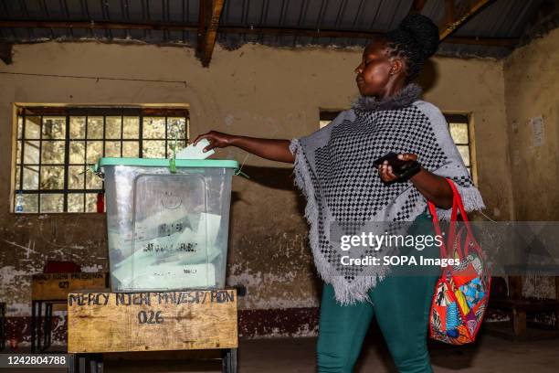 Caroline Jeptoo, 32 weeks pregnant, casts her ballot during the delayed Member of Parliament election at Mercy Njeri Primary School in Rongai...