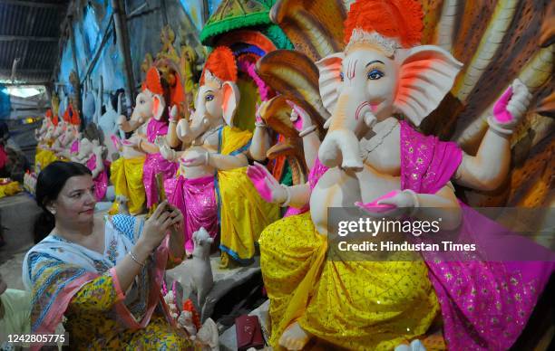 Residents purchasing Idol of lord Ganpati during the upcoming Ganesh Chaturthi on Wednesday at Kalibari on August 28, 2022 in Chandigarh, India.