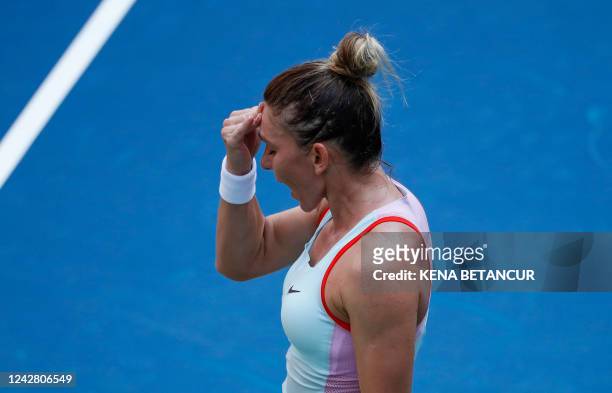 Simona Halep of Romania reacts as she plays against Daria Snigur of Ukraine during their 2022 US Open Tennis tournament women's singles first round...