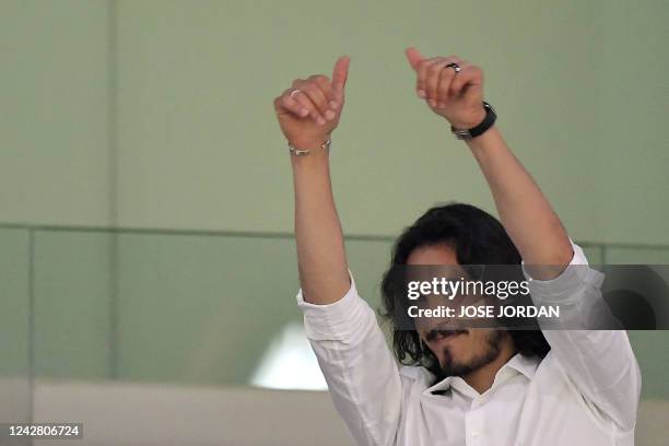 Former Manchester United striker Edinson Cavani gestures to the crowd as he attends the Spanish League football match between Valencia CF and Club...