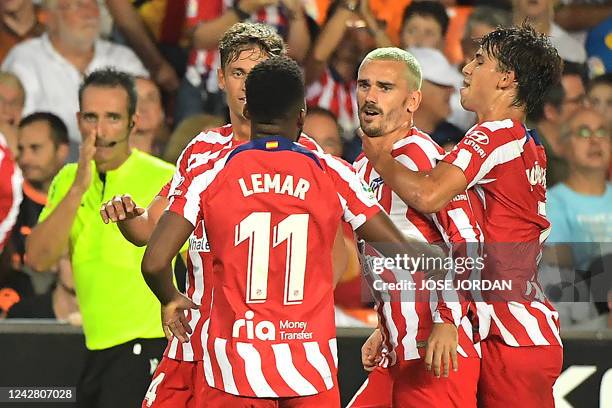 Atletico Madrid's French forward Antoine Griezmann celebrates scoring his team's first goal during the Spanish League football match between Valencia...