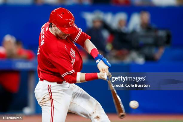 Danny Jansen of the Toronto Blue Jays hits a three-run home run in the seventh inning against the Chicago Cubs at Rogers Centre on August 29, 2022 in...