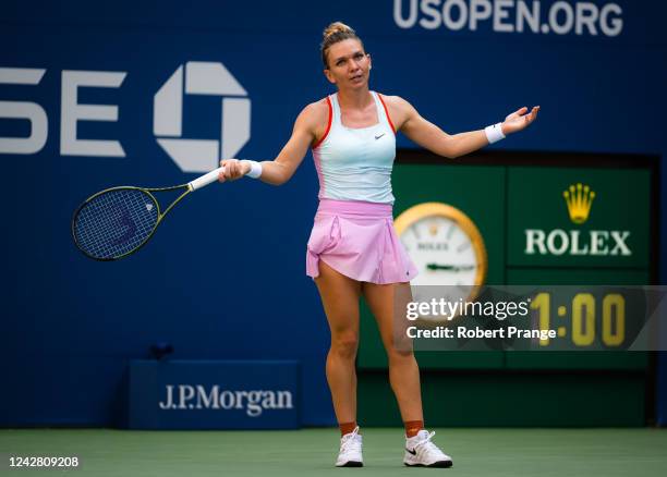 Simona Halep of Romania reacts frustrated while playing against Daria Snigur of Ukraine in her first round match on Day 1 of the US Open Tennis...