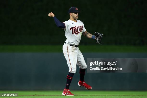 Carlos Correa of the Minnesota Twins throws the ball to first base to get out Rafael Devers of the Boston Red Sox in the seventh inning of the game...