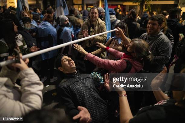 Militants dance and play in front of Cristina Fernandez's house in Buenos Aires, Argentina on Aug. 29, 2022. Political parties, young militants and...