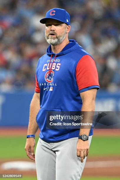 Chicago Cubs Manager David Ross walks back to the dugout after a pitching change during the regular season MLB game between the Chicago Cubs and...