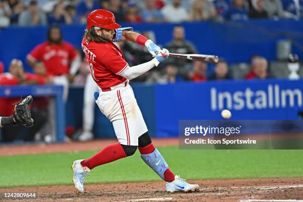 Toronto Blue Jays Short Stop Bo Bichette hits a fielders choice single in the tenth inning during the regular season MLB game between the Chicago...