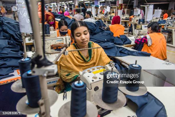 Women manufacturing clothes. The ready-made garment industry in Bangladesh is now a mainstay of this economic success story. Today, Bangladesh is one...