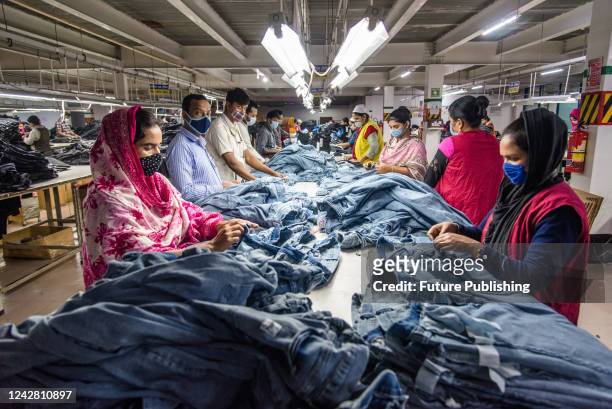 Women manufacturing clothes. The ready-made garment industry in Bangladesh is now a mainstay of this economic success story. Today, Bangladesh is one...
