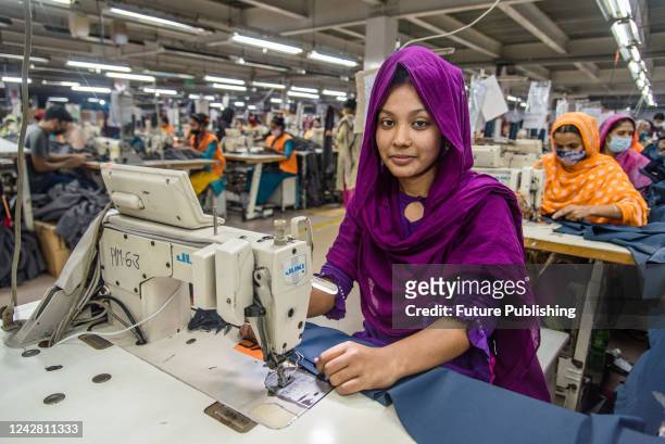 Women manufacturing clothes. The ready-made garment industry in Bangladesh is now a mainstay of this economic success story. Today, Bangladesh is one...