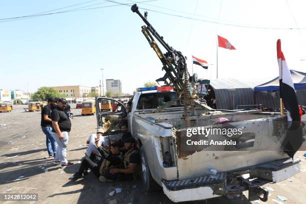 Supporters of Iraqi cleric Muqtada al-Sadr clash with security forces with heavy weapons at Green Zone after Sadr supporters stormed the Presidential...