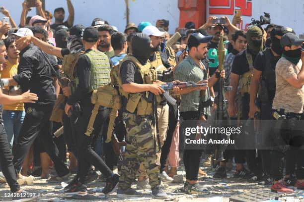 Supporters of Iraqi cleric Muqtada al-Sadr clash with security forces with heavy weapons at Green Zone after Sadr supporters stormed the Presidential...