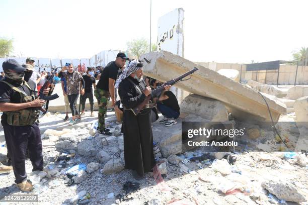 Supporters of Iraqi cleric Muqtada al-Sadr clash with security forces with heavy weapons at Green Zone after Sadr supporters stormed the Presidential...