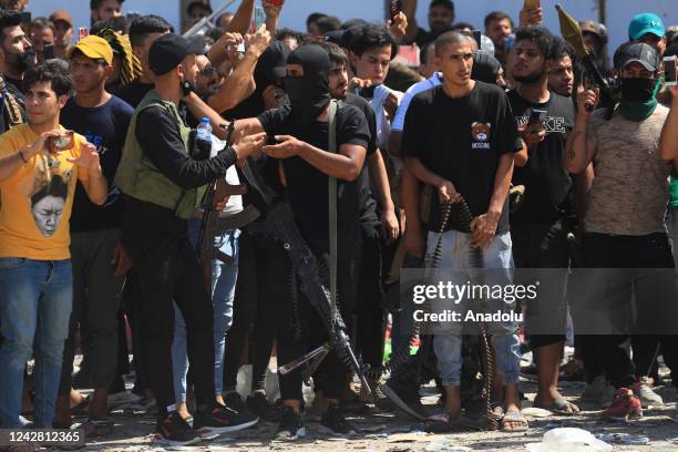 Supporters of Iraqi cleric Muqtada al-Sadr clash with security forces with heavy weapons at Green Zone after Sadr supporters stormed the Presidential...