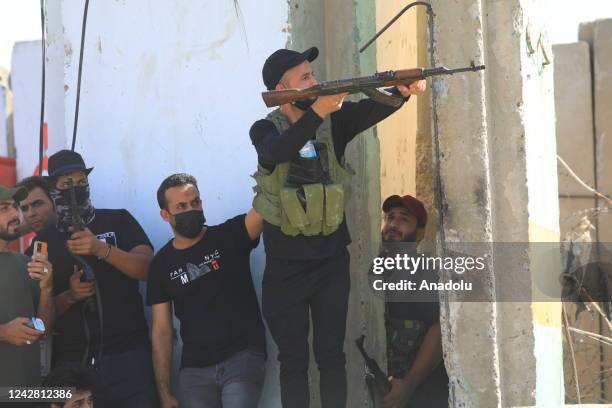 Supporters of Iraqi cleric Muqtada al-Sadr clash with security forces with heavy weapons at Green Zone after Sadr supporters stormed the Presidential...