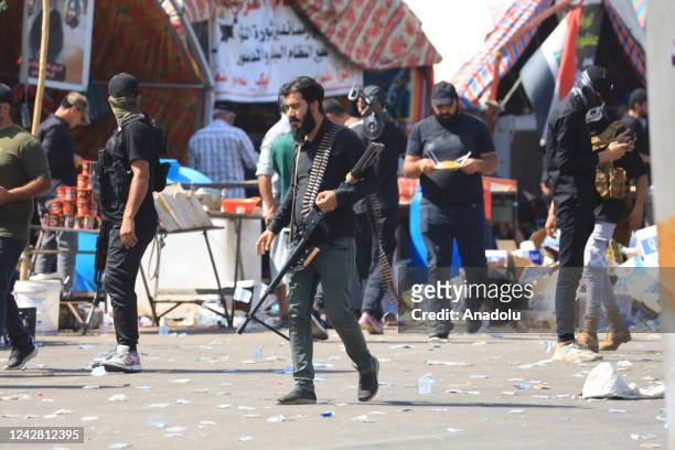 Supporters of Iraqi cleric Muqtada al-Sadr clash with security forces with heavy weapons at Green Zone after Sadr supporters stormed the Presidential...