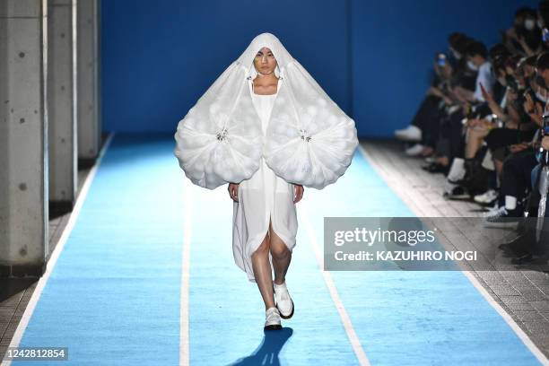 Model displays a creation from the UCF 2023 S/S Collection by UCF design team at Tokyo Fashion Week in Tokyo on August 30, 2022.