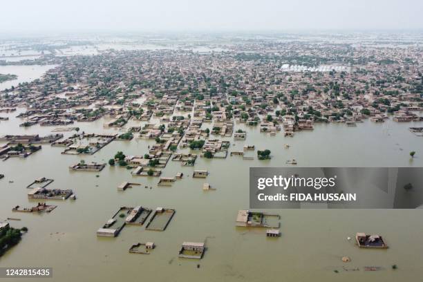 This aerial view shows a flooded residential area in Dera Allah Yar town after heavy monsoon rains in Jaffarabad district, Balochistan province on...