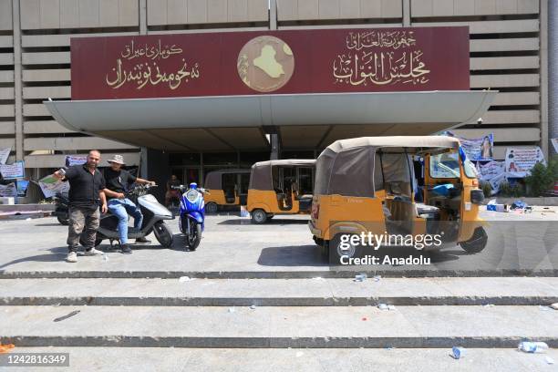 Supporters of Iraq's Shia cleric Muqtada al-Sadr begin to withdraw from the parliament building after al-Sadr's call for withdrawal in Baghdad, Iraq...