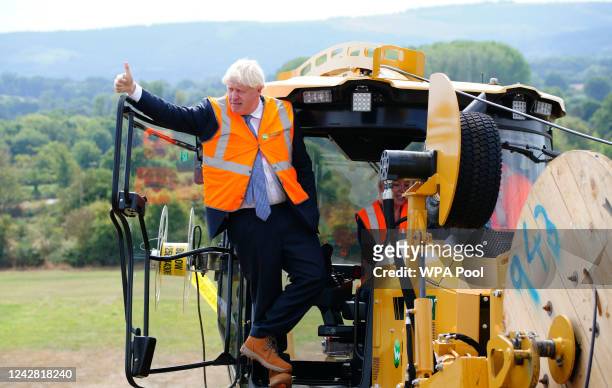 Prime Minister Boris Johnson during a visit to Henbury Farm in north Dorset, where Wessex Internet are laying fibre optics in the field on August 30,...
