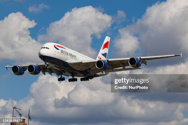 British Airways Airbus A380 airplane as seen on final approach flying over the houses in Myrtle Avenue, arriving for landing in London Heathrow...