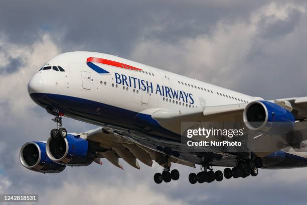 British Airways Airbus A380 airplane as seen on final approach flying over the houses in Myrtle Avenue, arriving for landing in London Heathrow...