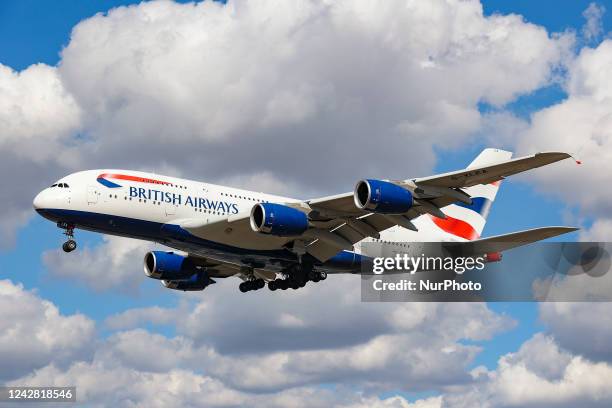 British Airways Airbus A380 airplane as seen on final approach flying over the houses in Myrtle Avenue, arriving for landing in London Heathrow...