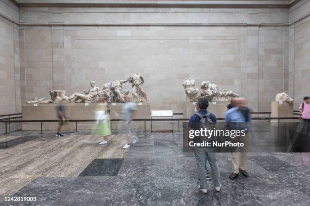 People admire the Parthenon Marbles inside the Parthenon Galleries in the British Museum. The marbles are also known as Elgin Marbles, with...