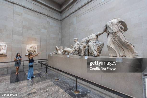 People admire the Parthenon Marbles inside the Parthenon Galleries in the British Museum. The marbles are also known as Elgin Marbles, with...