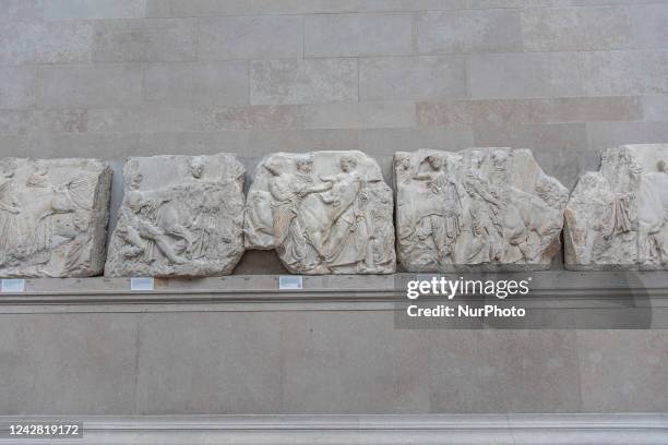 People admire the Parthenon Marbles inside the Parthenon Galleries in the British Museum. The marbles are also known as Elgin Marbles, with...