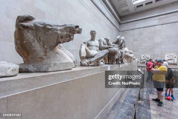 People admire the Parthenon Marbles inside the Parthenon Galleries in the British Museum. The marbles are also known as Elgin Marbles, with...