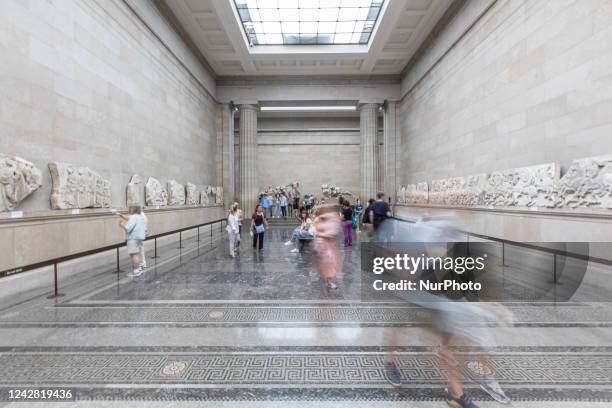 People admire the Parthenon Marbles inside the Parthenon Galleries in the British Museum. The marbles are also known as Elgin Marbles, with...