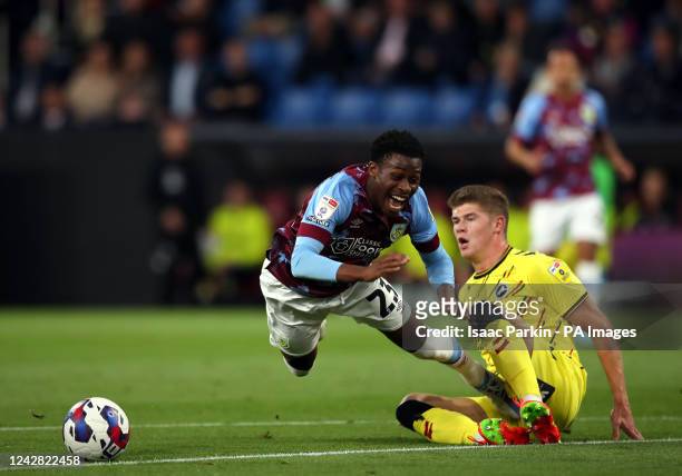 Burnley's Nathan Tella challenged by Millwall's Charlie Cresswell during the Sky Bet Championship match at Turf Moor, Burnley. Picture date: Tuesday...