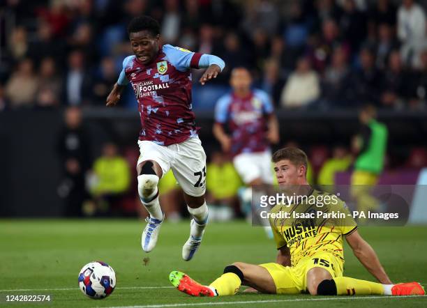 Burnley's Nathan Tella and Millwall's Charlie Cresswell battle for the ball during the Sky Bet Championship match at Turf Moor, Burnley. Picture...
