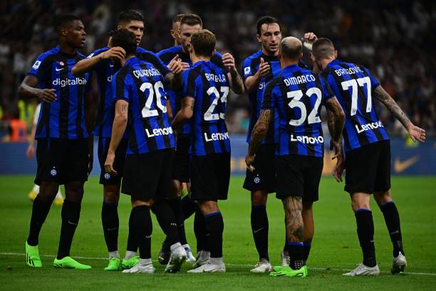 Inter Milan's Italian midfielder Nicolo Barella celebrates with teammates after scoring his team's second goal during the Italian Serie A football...