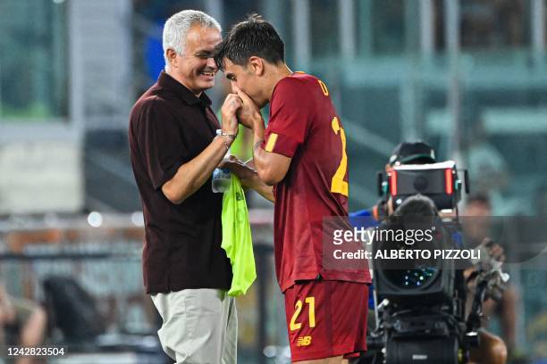 Roma's Argentinian forward Paulo Dybala jokes with AS Roma's Portuguese coach Jose Mourinho as he is being substituted during the Italian Serie A...