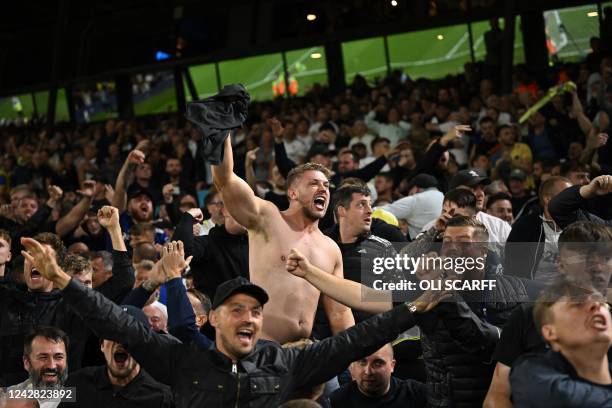 Leeds fans celebrate their goal during the English Premier League football match between Leeds United and Everton at Elland Road in Leeds, northern...