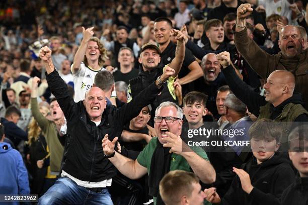 Leeds fans celebrate their goal during the English Premier League football match between Leeds United and Everton at Elland Road in Leeds, northern...