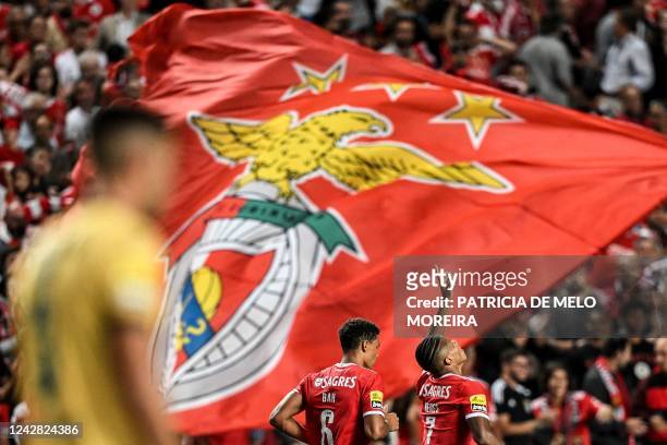 Benfica's Brazilian forward David Neres celebrates scoring his team's first goal during the Portugues League football match between SL Benfica and FC...