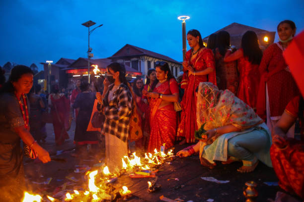 Nepalese Hindu women pay homage to Lord Shiva, the Hindu god of destruction at the pashupatinath temple during the Teej festival in Kathmandu, Nepal...