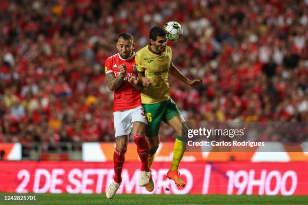 Nicolas Otamendi of SL Benfica vies with Rui Pires of FC Pacos de Ferreira for the ball possession during the Liga Portugal Bwin match between SL...