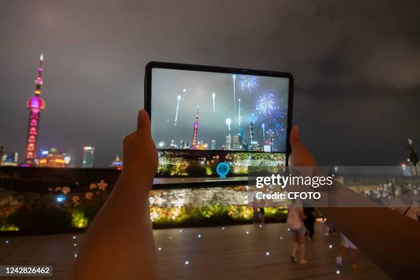 Citizens experience the city digital twin app based on the metaverse concept at the Bund in Shanghai, China, Aug 30, 2022. The Fifth World Conference...