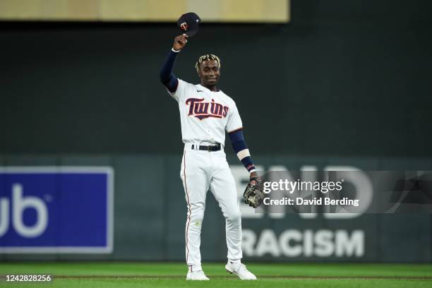 Nick Gordon of the Minnesota Twins acknowledges fans during a curtain call after hitting his first career grand slam in the sixth inning of the game...