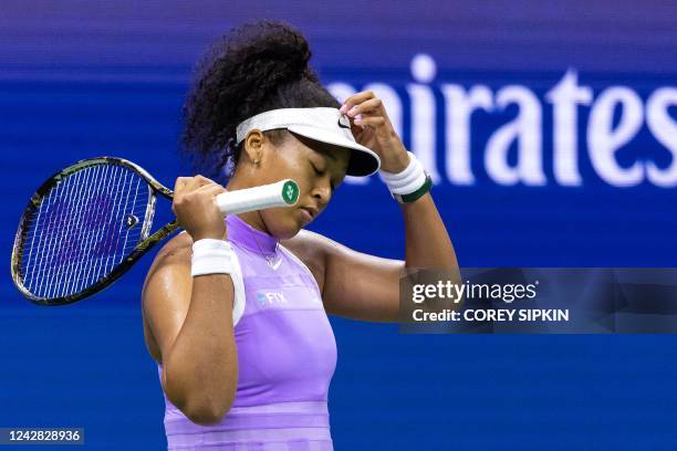 Japan's Naomi Osaka gestures after a point during her 2022 US Open Tennis tournament women's singles first round match against USA's Danielle Collins...