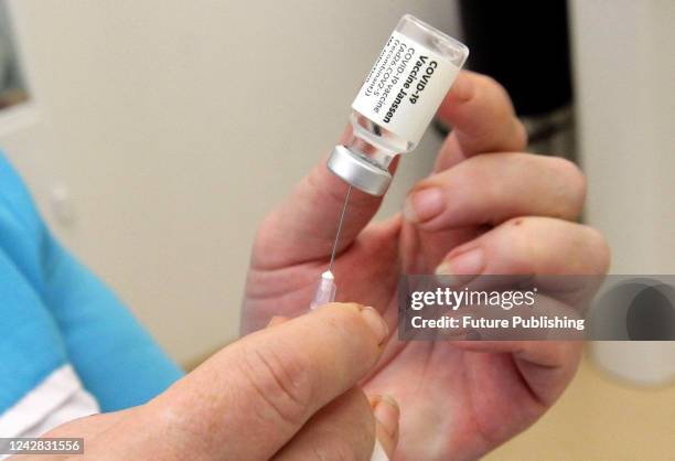 Healthcare worker draws a dose from a vial during the COVID-19 vaccination campaign in Dnipro, central Ukraine.