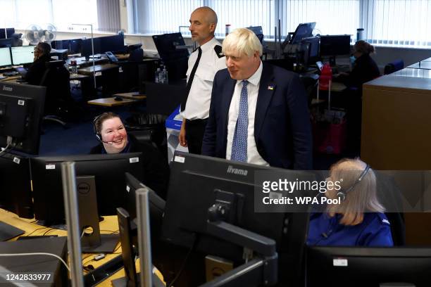 British Prime Minister Boris Johnson meets call handlers in Control Room during a visit with members of the Thames Valley Police, at Milton Keynes...